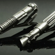 Illustration for article titled Sharp Dressers Secure Ties, TIEs with Lightsaber Tie Tacks